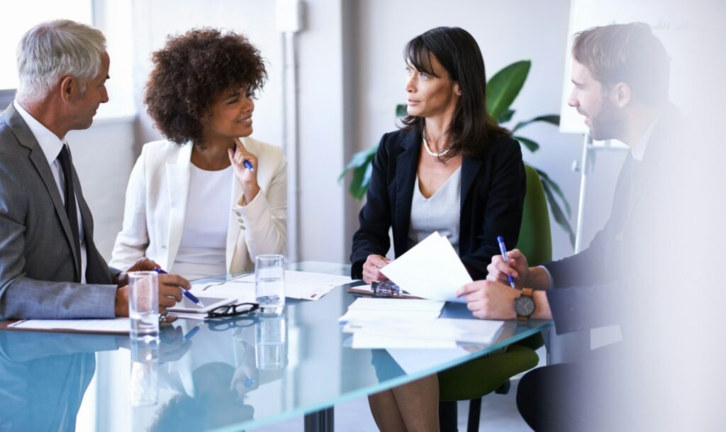 Business discussions. Cropped shot of a group of business colleagues meeting in the boardroom.